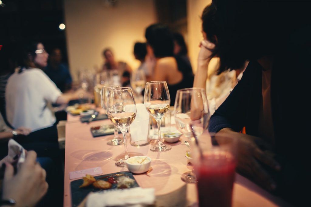 a table with glasses and food on it