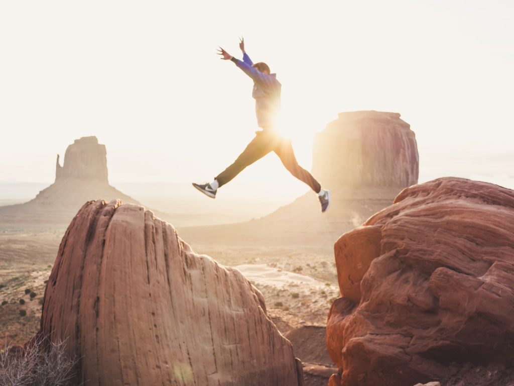 a person jumping off a cliff
