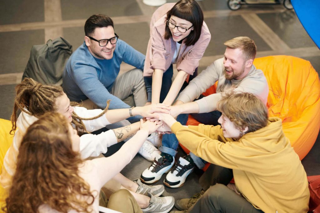 a group of people sitting on the floor