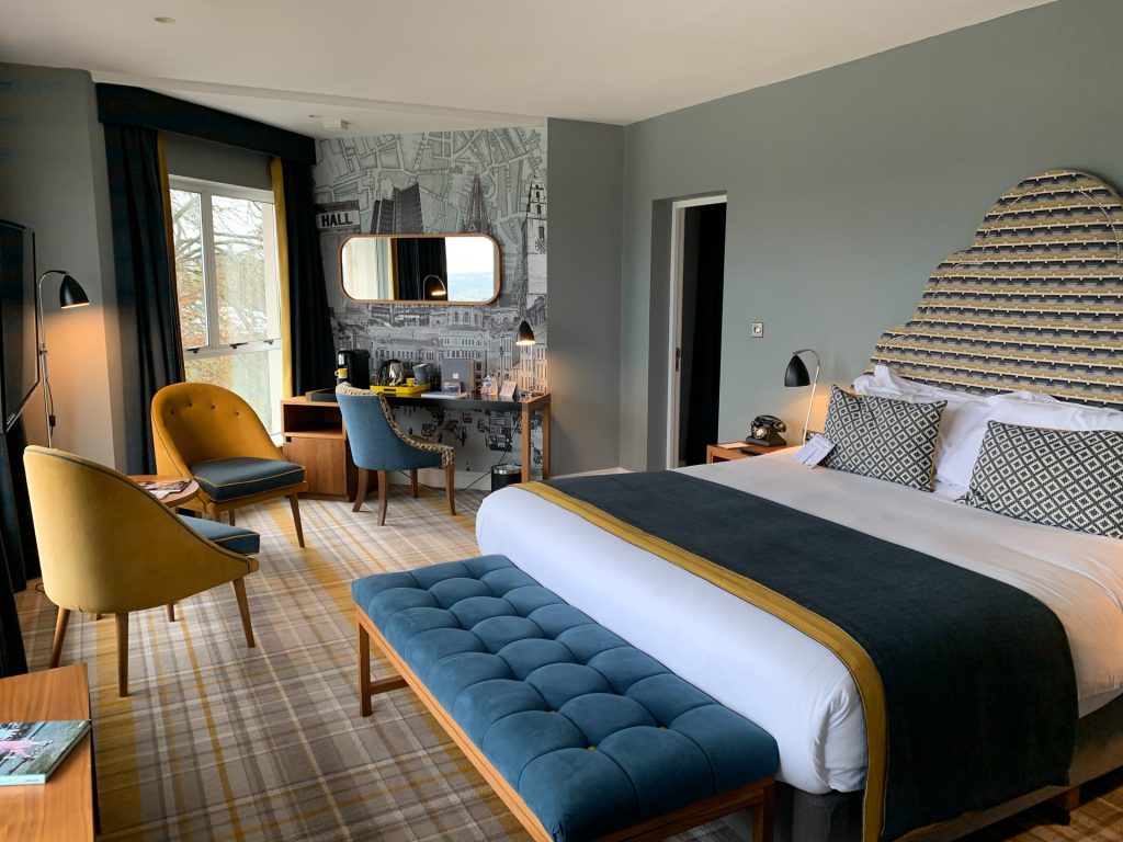 a bedroom with a bed and a television