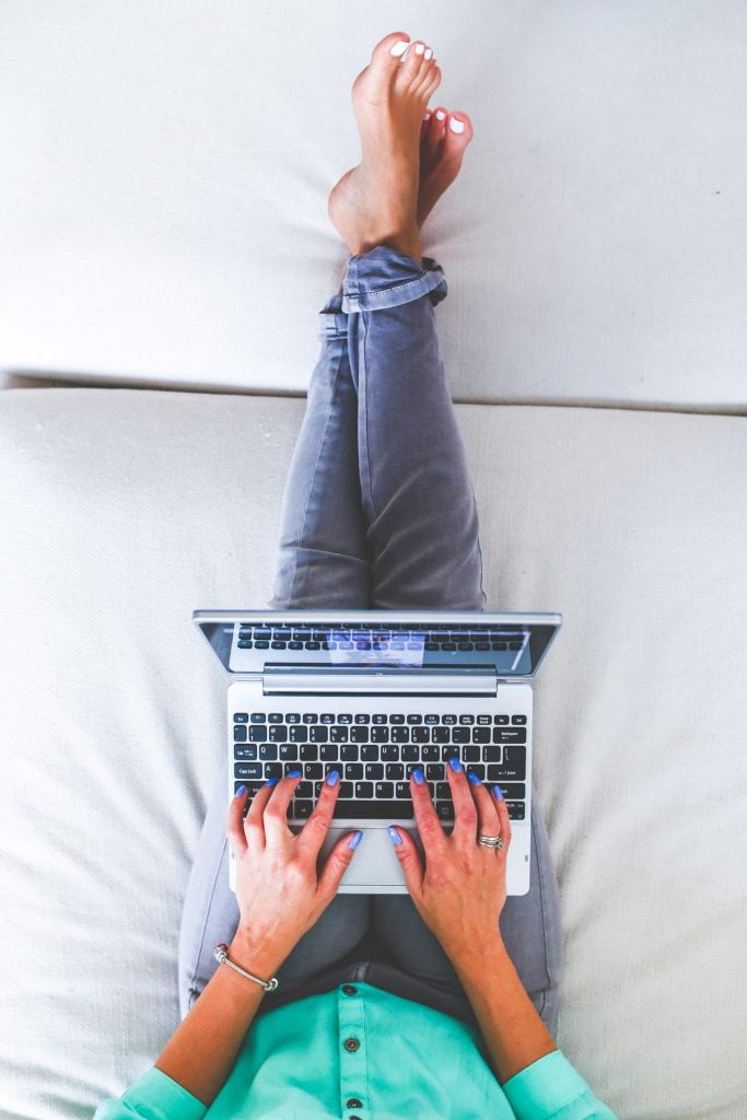 a person standing on a laptop